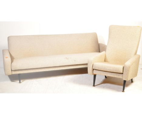 A mid century retro sofa day bed and armchair in the manner of Scandart. The sofa and armchair being raised on tapering eboni