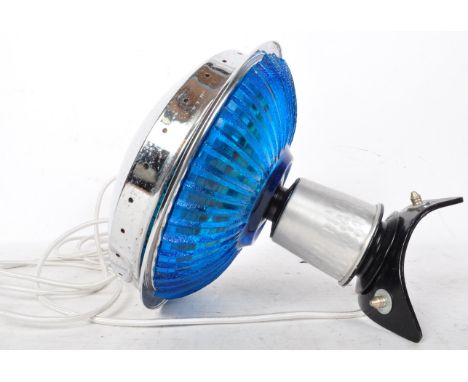 A retro vintage mid 20th century UFO table lamp of chrome and blue pressed glass construction upon a raised tubular stand.&nb