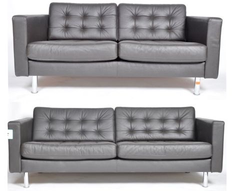 After Florence Knoll - A pair of contemporary two seat sofa settee's&nbsp; comprising of black button backed leather cushions