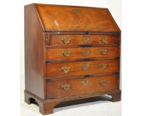A George III early 19th century mahogany inlaid fall front writing bureau. The bureau with slope front top with brass escutch