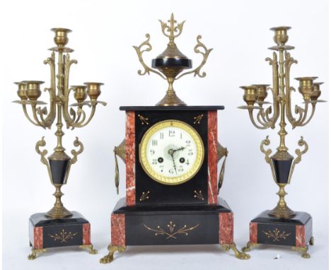 A 19th century Victorian slate mantel clock garniture. The clock having Arabic numeral to the chapter ring with fleur de lys 