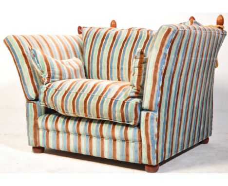 Contemporary knoll style armchair with stripe fabric having finial and rope adornments to the top together with loose squab c