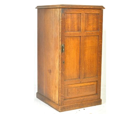 An Edwardian mahogany upright pedestal gramophone cabinet, Raised on plinth base with full length fielded panel door housing 