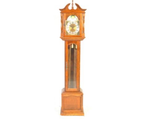 A 20th century oak cased Tempus Fugit Longcase clock. Oak case with glass fronted hood with inset brass and silvered dial hav