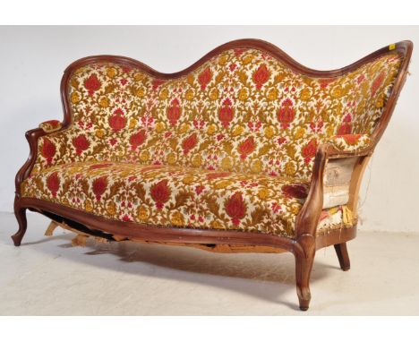 A 19th century Victorian mahogany double ended chesterfield sofa settee. The settee having a mahogany winged hump-back frame 