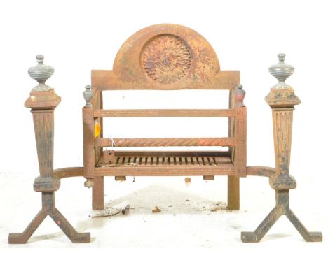 Early 20th century architectural cast iron Adams revival fireplace. The set comprising of grate with arched back, grill and t