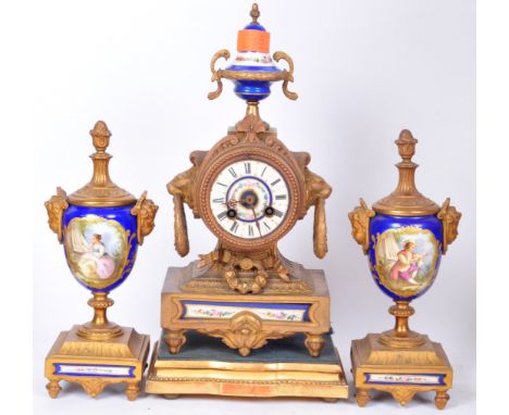 An early 20th century French brass and blue enamel garniture clock. The clock having a finial top, polychrome floral decorati