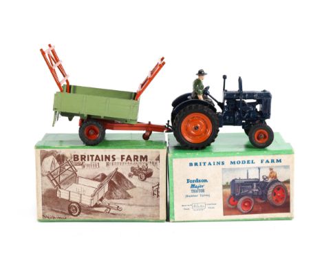 A Britains Model Farm Fordson Major Tractor (rubber tyres) No.128F. In dark blue with orange wheels and black rubber tyres. C