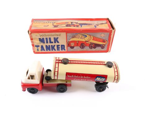 A Wells Brimtoy Bedford 'S' type articulated Milk Tanker. A larger example, 26cm overall length. Brightly litho detailed in c