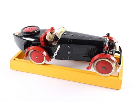 A rare 1930's No.2 Meccano Constructor Car. A short wheelbase boat tail example in black with red mudguards, red seat, red wh