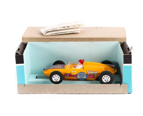 A Hoffenhauser  rear engine racing car in yellow with driver. Contained in its original brown card outer box with pull out in