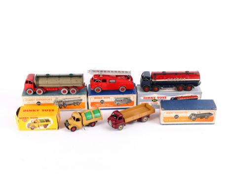 5 Dinky Toys. A Big Bedford Lorry (522) in maroon and tan with beige wheels. A Commer Fire Engine (555), red with silver ladd