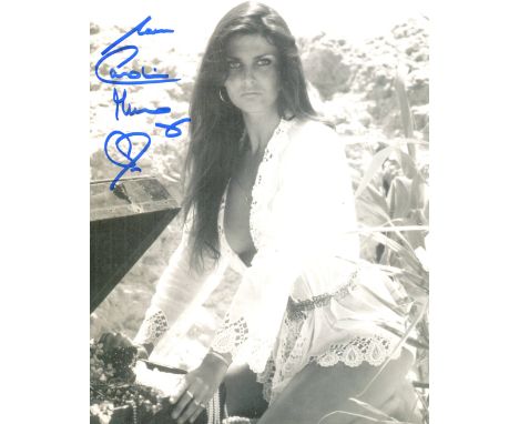 Bond girl. 8x10 inch photo signed by The Spy Who Loved Me Bond girl Caroline Munro in a sexy pose. Good Condition. All autogr