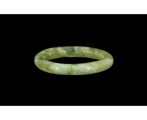 Chinese Green Jadeite Bangle with mutton fat inclusions, 3.5'' diameter