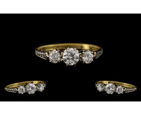 18ct Gold and Platinum Attractive Three Stone Diamond Set Ring, marked 18ct gold and platinum, the three round brilliant cut 