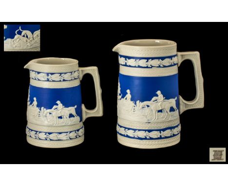 Two Antique Copeland Spode Jasper Ware Jugs with hunting scenes, in cream, applied to a blue ground; one 5 inches (12.5cms) h