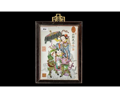 Chinese 20thC Painted Tile Picture depicting a child riding a Kylin with a consort; fully signed with seal marks; in wooden f