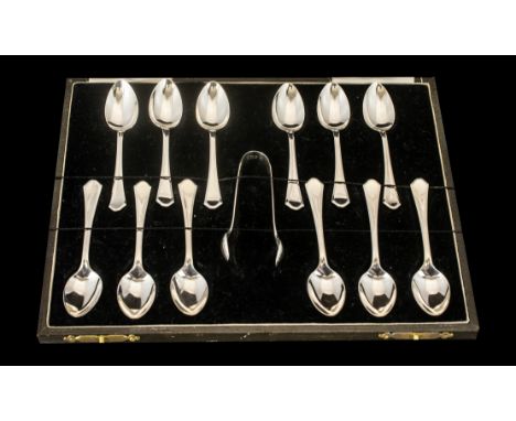 A Boxed Set of 12 Sterling Silver Teaspoons with Matching Sugar Nips.  Excellent quality and condition.  Hallmark Birmingham 