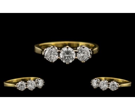 18ct Gold Attractive Three Stone Diamond Ring, the three modern, brilliant cut diamonds of excellent colour and clarity, with