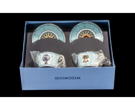 Wedgwood 'A Celebration of the Millennium' Boxed Set of Two Cups & Saucers.  Wedgwood Millennium bone china set in pale blue 