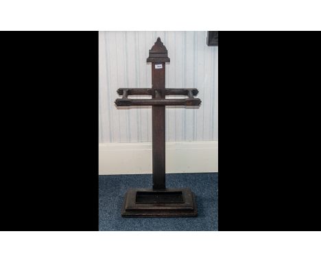 An Arts and Crafts Oak Stick Stand of simple form, with two apertures for umbrellas and sticks. Fitted with a tin drip tray. 