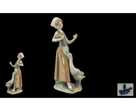 Lladro Handpainted Porcelain Figure ' Girl with Duck'  Model No. 1052.  Issued 1969 - 1998.  Height 9" - 22.5 cm. 1st quality