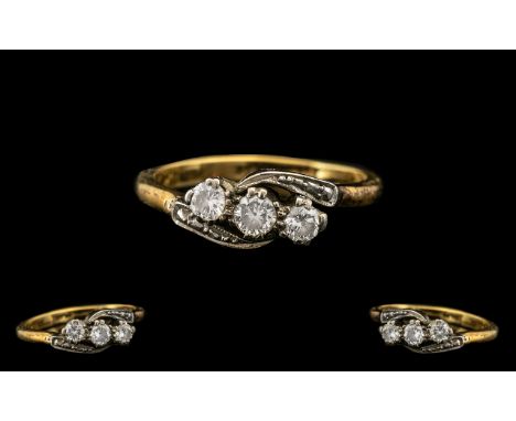 An Antique 18ct Three Stone Diamond Ring set on a twist.  Three round brilliant cut diamonds, estimated weight approx. .35 ct
