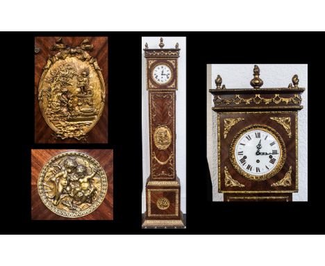A French Ormolu Mounted and Kingwood Reproduction Grandmother Clock with a white enamel dial, Ormolu flame finial to the top,