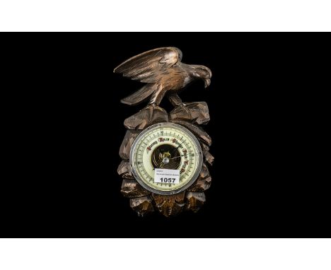 Black Forest Carved Wood Wall Barometer depicting a bird standing on a rocky outcrop; with an inset dial; 11 inches high x 6 