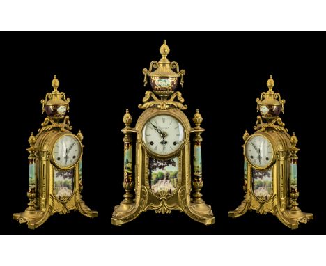 A French Empire-Style Mantle Clock with brass case with painted supports and urn finial.  White enamelled dial with Roman num