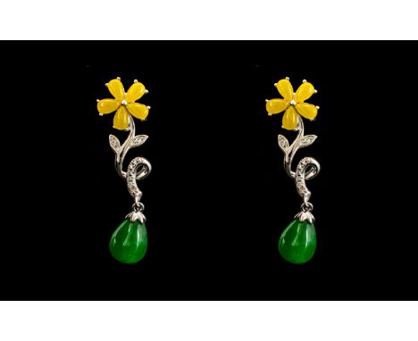 Green Jade Drop and Yellow Jade Flower Pendant Earrings, each a solid pear shaped drop of green jade suspended below a flower