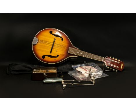 An 8 String Banjo marked Terado. Together with A music sheet stand, a Metronome, various strings, and a Hohner German Mouth o