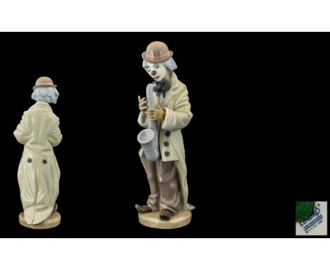Lladro Handpainted Porcelain Figure ' Sad Sax' Clown,  model No. 5471.  Issued 1988.  Sculptor Franciso Catala.  Height 8.75"