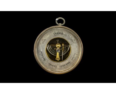 A 19thC Scottish Barometer with silvered dial and a 5 1/2" brass case. Dial marked for Gardner &amp; Co. 