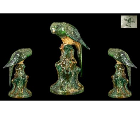 Royal Worcester Crown Ware Hand Painted Parrot on Perch, CW 236, in greens and browns, a scarce colourway, date mark 1926; 7.