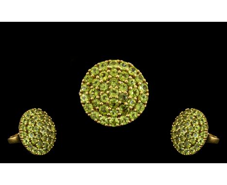 Peridot Circular Cluster Ring, 11cts of graduated, round cut, bright sparkling peridots in three closely set circles, around 