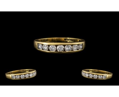 18ct Gold Attractive 7 Stone Diamond Set Ring marked 750 - 18 ct.  The round brilliant cut diamonds of good colour and clarit