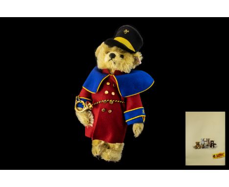 Heinrich the Postman Bear Made by Steiff. The jointed bear has a coat of blond mohair with tan felt pads, embroidered nose, m