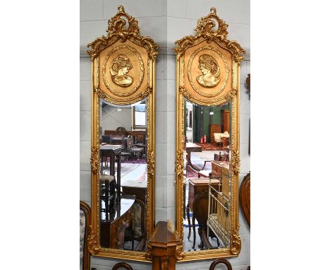 A Pair of Neo Rococo Style Gilt Framed Mirrors, with arched tops, decorated in relief with portrait medallions, 51cm by 180cm
