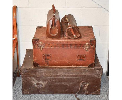A Leather Travelling Trunk, a smaller canvas example and two leather Gladstone bags