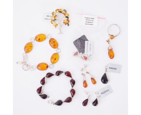 A mixed lot of silver &amp; amber jewellery to include a tree brooch with mixed coloured amber, a Baltic amber ring, two pair