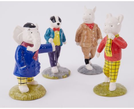 A set of four Beswick Rupert Bear figurines comprising Rupert Bear, Edward Trunk, Bill Badger and Podgy Pig, boxed.