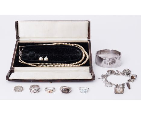 A mixed lot to include faux pearls, faux pearl studs, silver engraved bangle, 37.27gm, silver charm bracelet, 37.57gm, four s