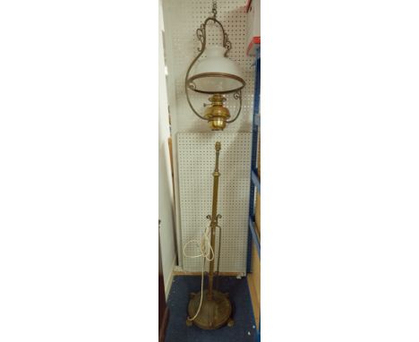 A brass floor standing rising lamp together with a hanging brass oil lamp with white shade (2)