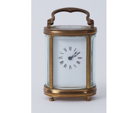 A miniature French carriage clock with platform escapement, height 8cm.
