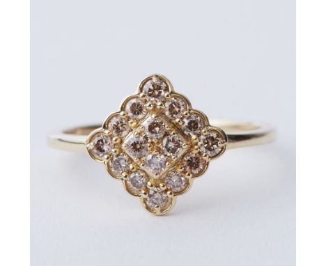 A 9ct yellow gold ring set with a total of 0.50 carats of round brilliant cut champagne Argyle Diamonds from the Argyle Diamo