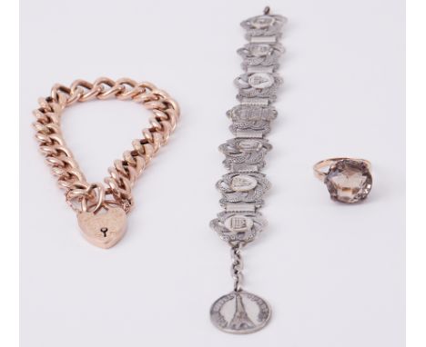 A 9ct rose gold curb link bracelet with heart padlock, 16.90gm, a gold cocktail ring with a paste stone (no hallmarks &amp; n