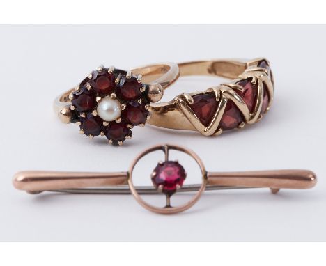 A mixed lot to include a 9ct yellow gold garnet &amp; pearl ring, 3.30gm, a 9ct yellow gold ring set with triangular cut garn