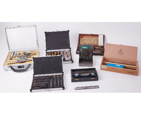 Assorted tools including taps and wrenches, lathe tools etc.