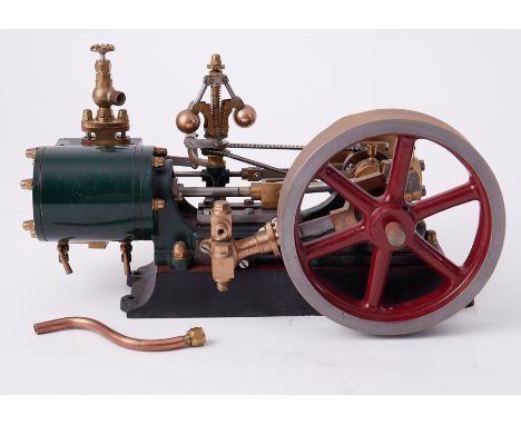 A Stuart No.9 horizontal steam engine complete with Governor, 6" high and 11" long.